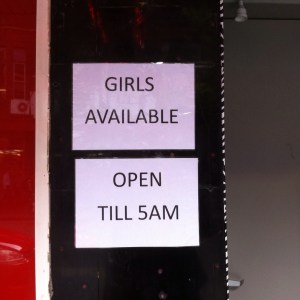 Sign outside a brothel in Kings Cross.