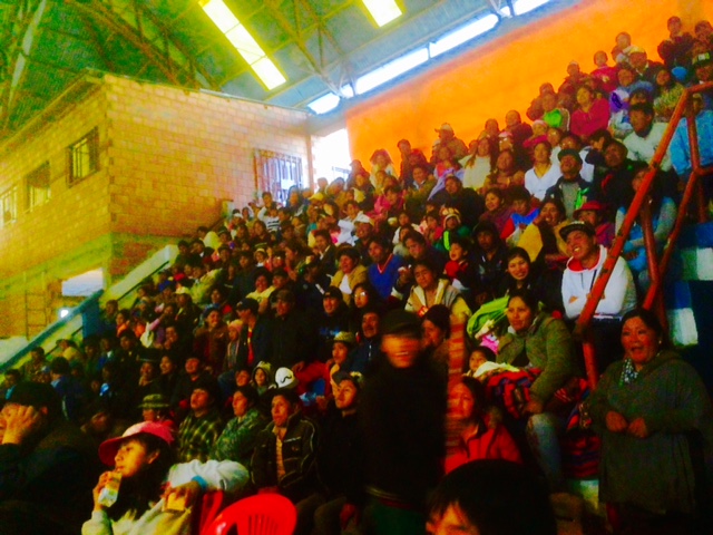 Locals watch the wrestling.